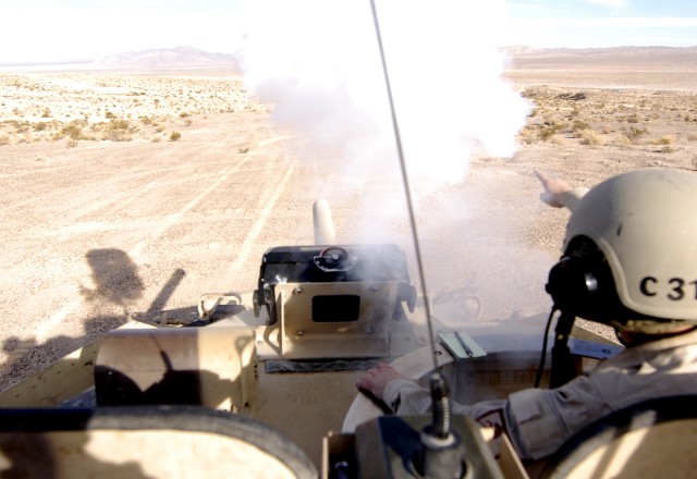 11th Armored Cavalry Regiment, boresights the cannon on an Opposing Force Surrogate Vehicle at Fort Irwin, Calif., March 13.