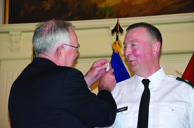 Father pins star on son