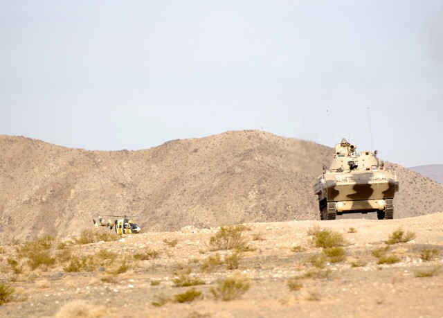 Donovian Forces, depicted by U.S. Army Soldiers from the 11th Armored Cavalry Regiment, prepare to invade the city of Razish at the National Training Center, Fort Irwin, Calif., March 16.