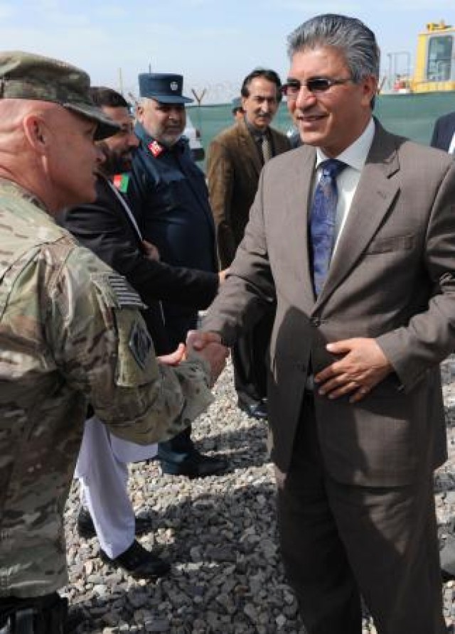 Lt. Col. Gordon "Mark" Bartley (left), Herat area office, USACE Afghanistan Engineer District-South, greets Herat provincial governor Dr. Daud Saba before a groundbreaking ceremony for two fire statio