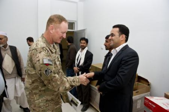 Col. Ben Wham, commander, USACE Afghanistan Engineer District-South, speaks with a faculty member from the Herat University engineering department