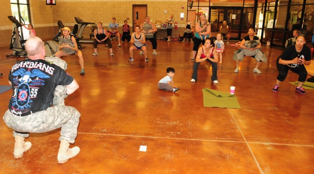 Bulletproof mommas take part in combat cardio