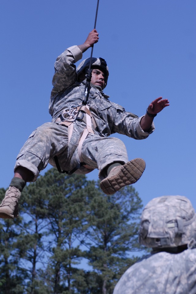 Army Sgt. 1st Class Vince Castellanos attempts to regain footing during the Best Ranger Competition