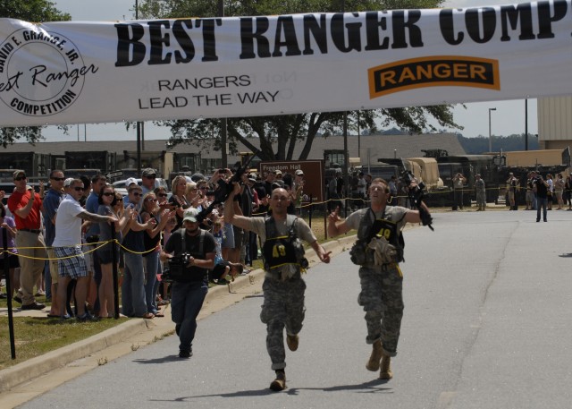 Army Cpt. Robert Killian and 1st Lt. Nicholas Plocar cross the finish line for the final event at the 2012 Best Ranger Competition