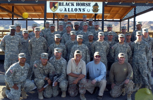 Students from the Basic Sniper Observer Course pose for a graduation photo 