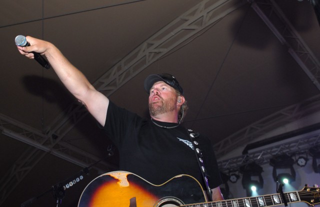 Playing to the base: Toby Keith sings at Camp Buehring during his 'Live In Overdrive' USO tour