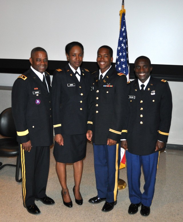 Newly minted 2nd Lts. Shaneka Jones, Bryan Fisher and Schmidt Belleus pose with Maj. Gen. Reuben D. Jones, deputy commanding general for operations of the Army Installation Management Command. Jones i