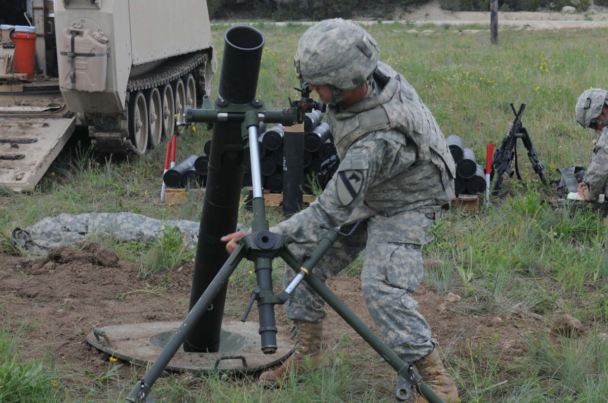 Long Knife mortar men hang rounds to improve crew proficiency Article