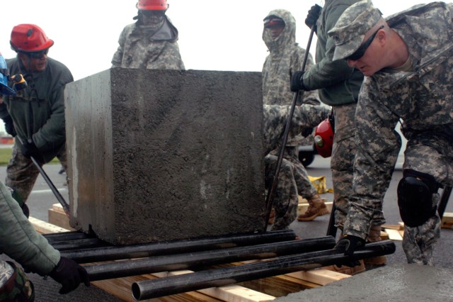 Soldiers kick Off Homeland Response Force Exercise by moving concrete cube
