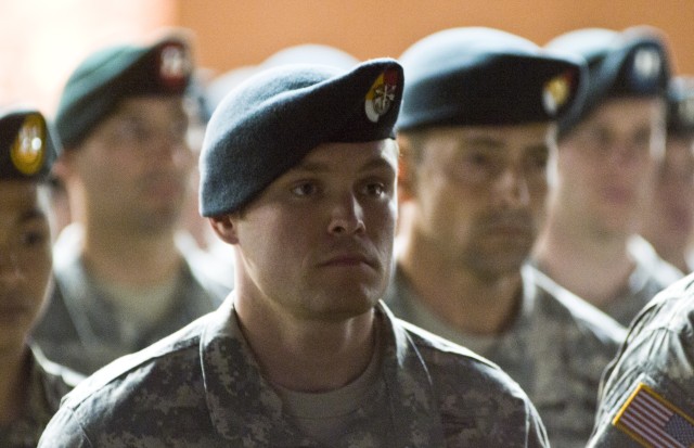 Special Forces Soldiers graduate qualification training, don green berets