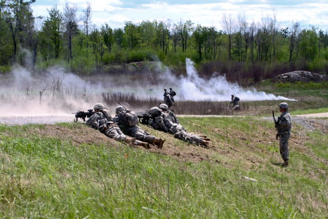 Soldiers from Alpha Troop, 1st Squadron, 89th Cavalry Regiment perform an assault on their final objective during a live-fire exercise May 17