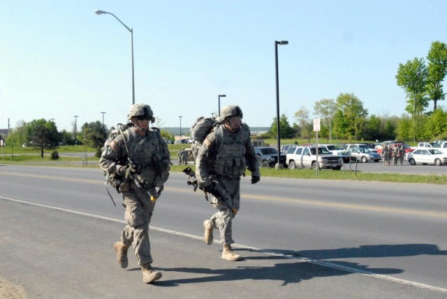 2nd Lt. Yevgen Gutman a native of San Diego (Left) and 1st Lt. Oleg Y. Sheynfeld with Headquarters and Headquarters Company, 4th Battalion, 31st Infantry Regiment, sprint to finish a 12-mile road marc
