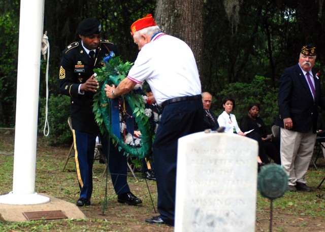 Veterans, Soldiers, Civilians Brave Tropical Storm to Celebrate Fallen Heroes