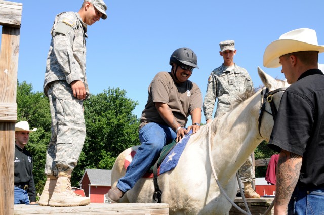 'Old Guard' Soldiers, horses assist wounded warriors with therapeutic riding