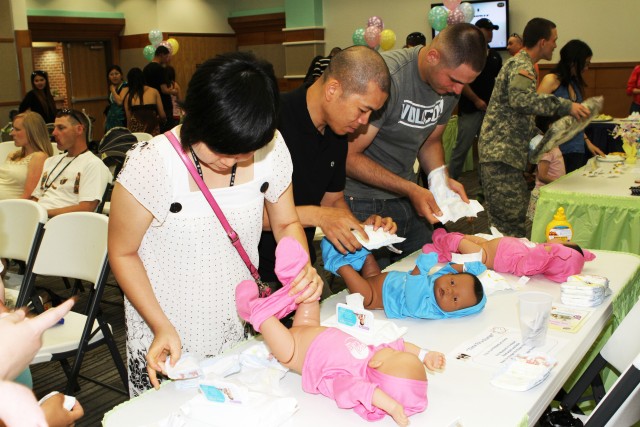 Baby shower introduces dads to diapers