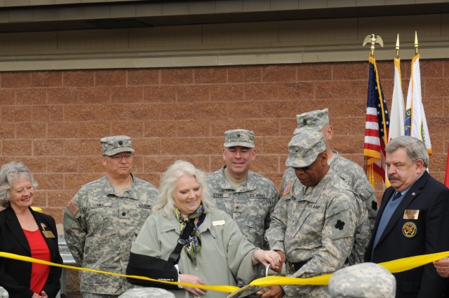 Diginitaries at the Fort Custer Reserve Center cut the ribbon at the Fort Custer Reserve Center Dedication
