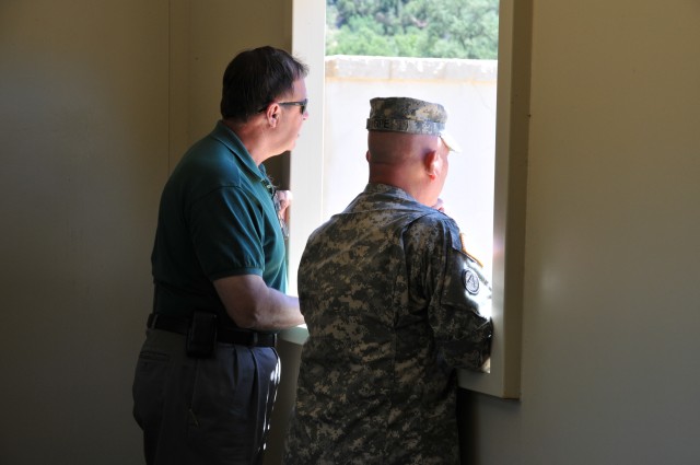 Robert Smiley and Command Sgt. Maj. John Gipe observe training at Fort Hunter Liggett.