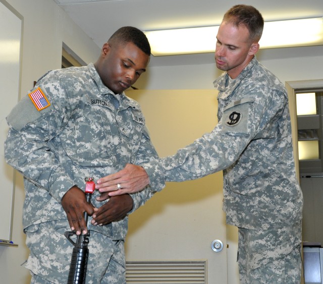 Drill Sergeant Moss demonstrates order arms at DSOY competition