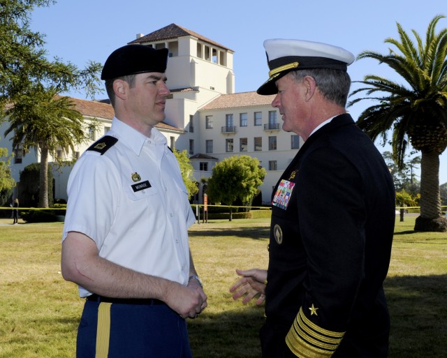 Master Sgt. James Monroe congratulated by Commander of the U.S. Special Operations Command, Adm. William McRaven