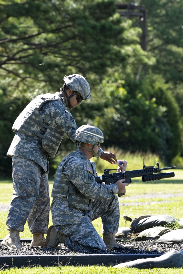 Drill Sergeant Marquez demonstrates M203 grenade launcher at DSOY competition