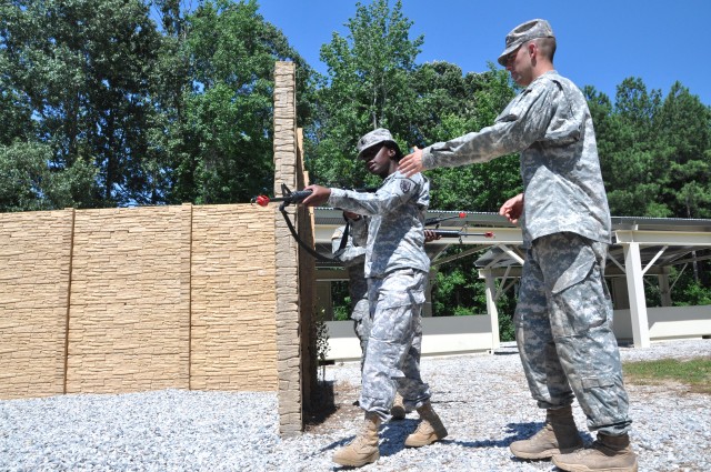 Drill Sergeant Heilman explains how to enter and clear a room during DSOY competition