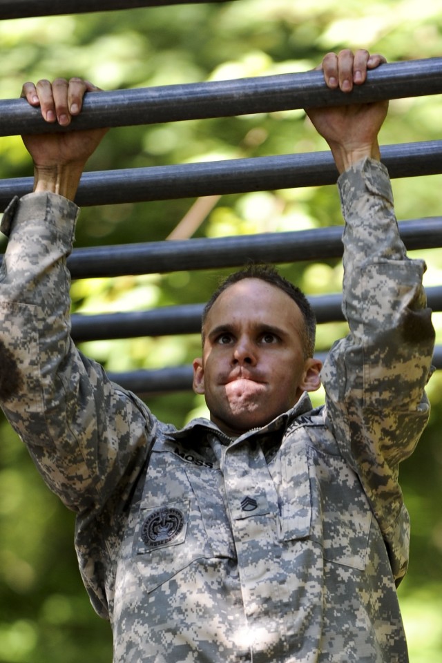 Drill Sergeant Moss completes final obstacle of confidence course in DSOY competition