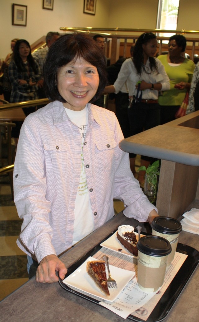 A happy customer at Torii Station's new coffee shop