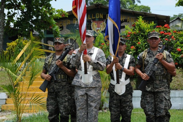 Spc. Juan Michael Jimenez, 40th Communications Company, participates in a joint service color guard at the closing ceremonies.