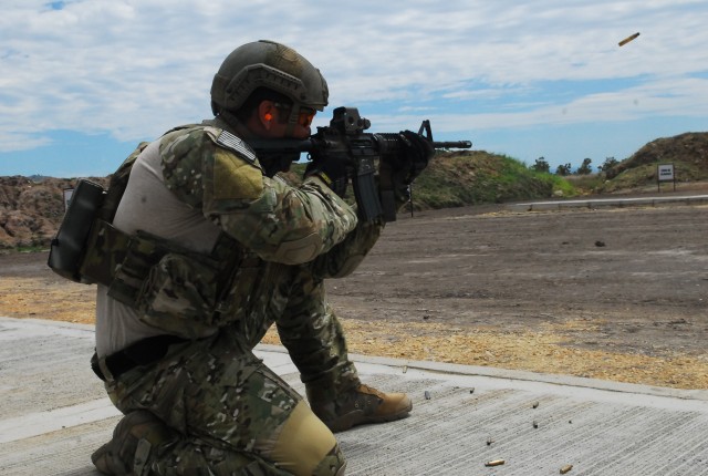 U.S. special operations forces competes in the rifle qualification event for Fuerzas Comando
