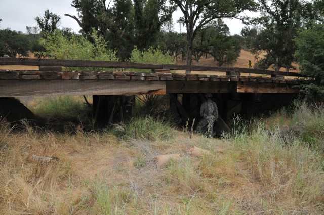 396th Engineers rig bridge at Fort Hunter Liggett with explosives