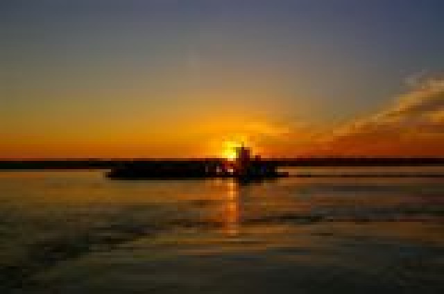 Dredging Vessel at Sunrise on the Mississippi River