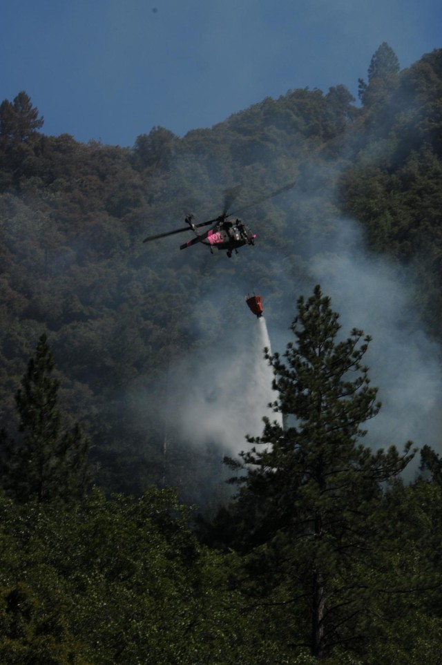 California Army National Guard helicopter drops water on Robbers Fire
