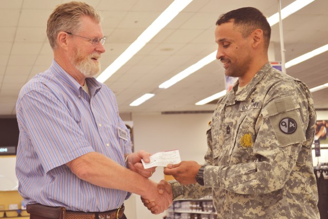 Author donates proceeds to HHC 94th Training Division's Family Readiness Group