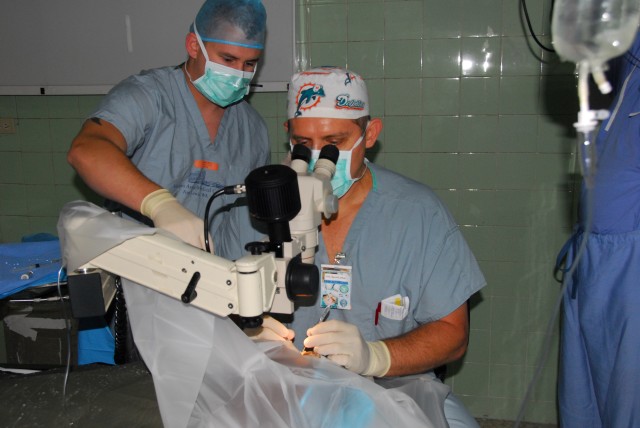 U.S. Army Ophthalmologist providing care to Dominicans, working with host nation doctors