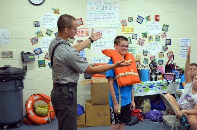 Corps Ranger shows how to fit a life jacket 