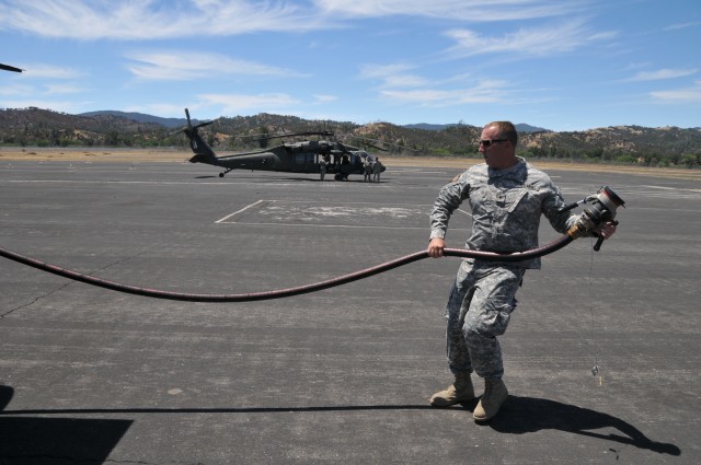 Helicopters top-off at Tusi at Fort Hunter Liggett