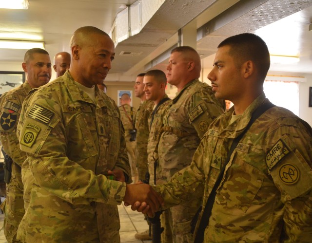 401st AFSB Soldiers receive coins from COMISAF Command Sergeant Major