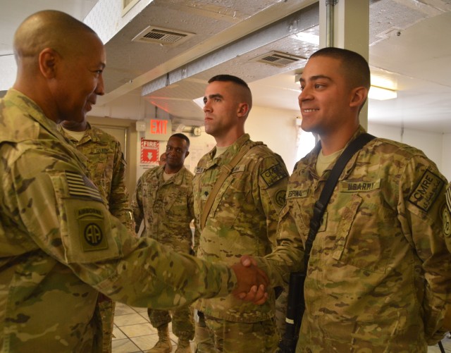 401st AFSB Soldiers receive coins from COMISAF Command Sergeant Major