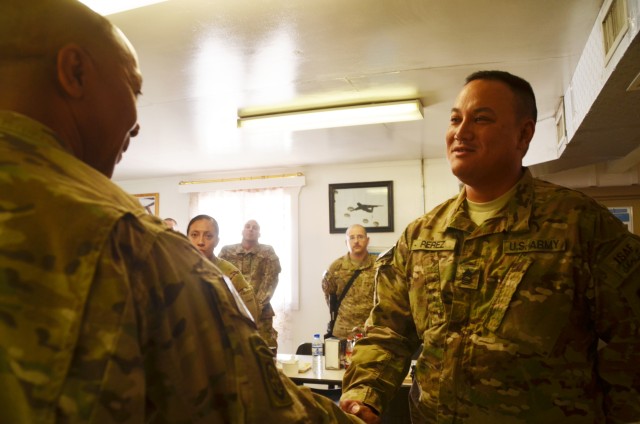 401st Soldiers receive coins from COMISAF Command Sergeant Major