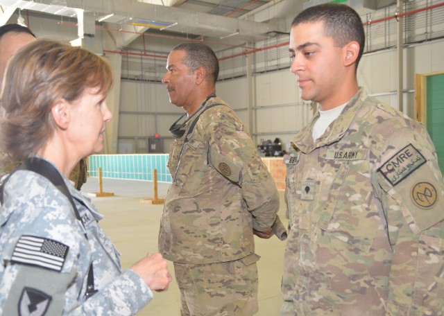 Soldiers receive coins from Brig. Gen. LeDoux