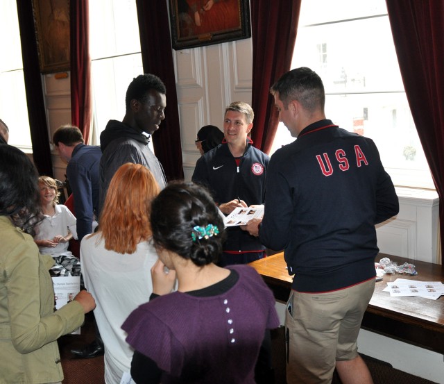 Soldiers sign autographs
