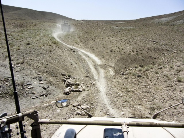 The route recon column moves through difficult terrain
