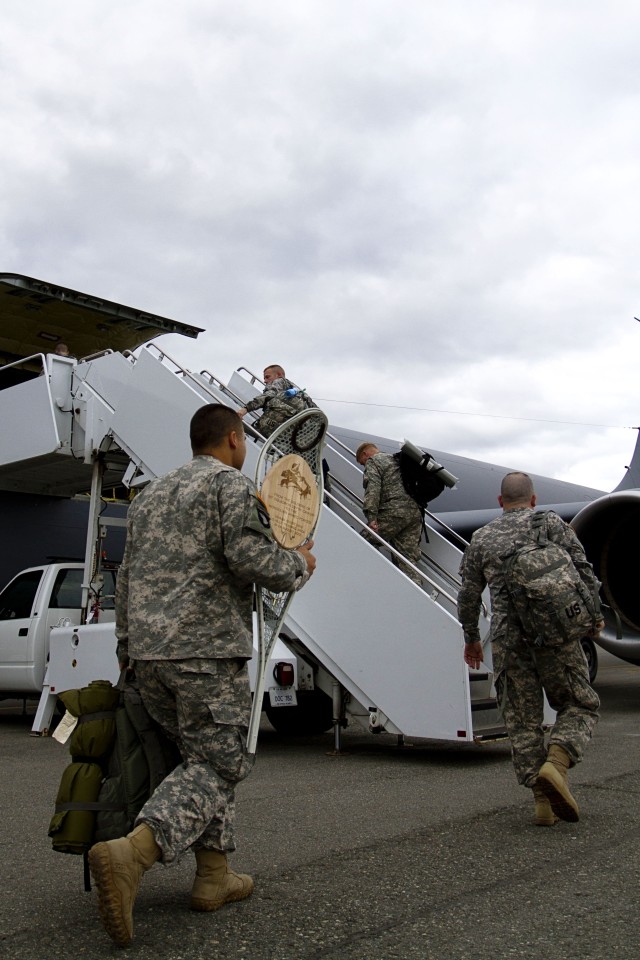 Alaska National Guard members board a KC-135