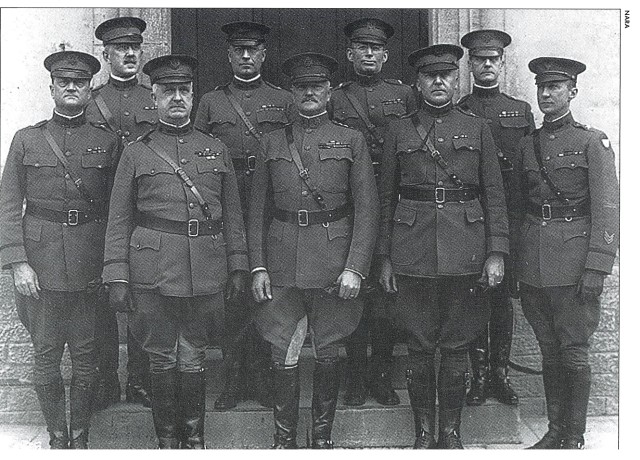 Image: General Pershing and the Staff of the American Expeditionary Forces. Dennis Nolan, G2, is the second from the right on the back row.