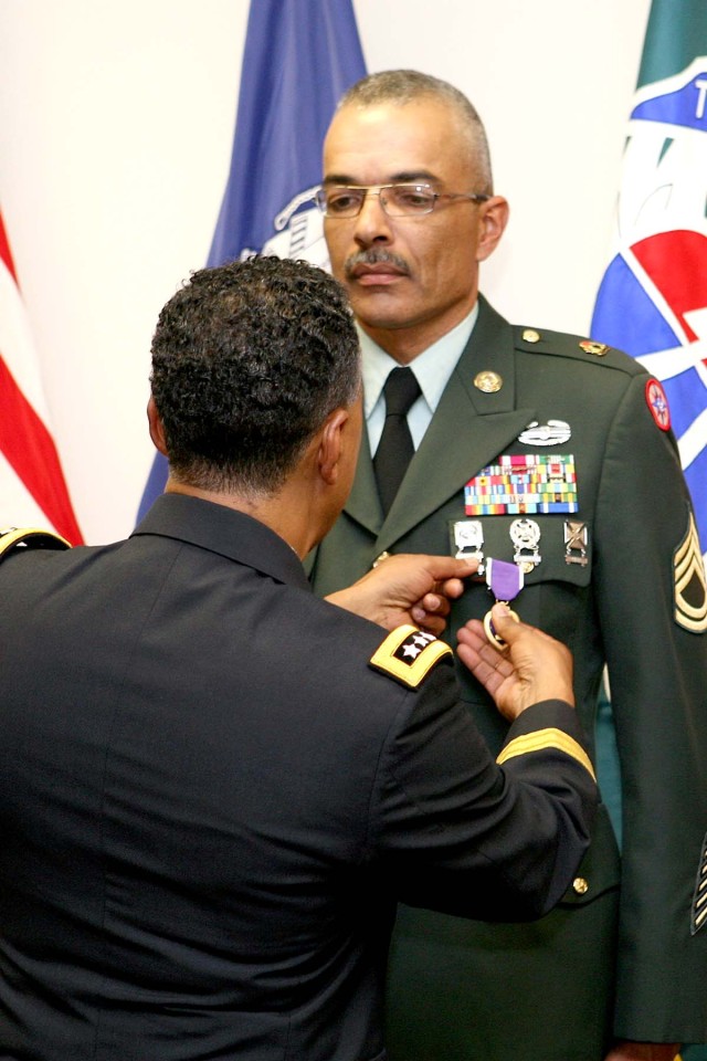 Norman receives Purple Heart award from Gen. Via