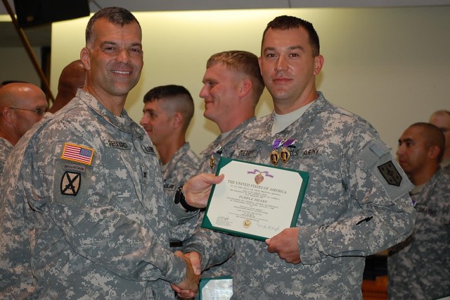 Two time Purple Heart awardee poses with commander