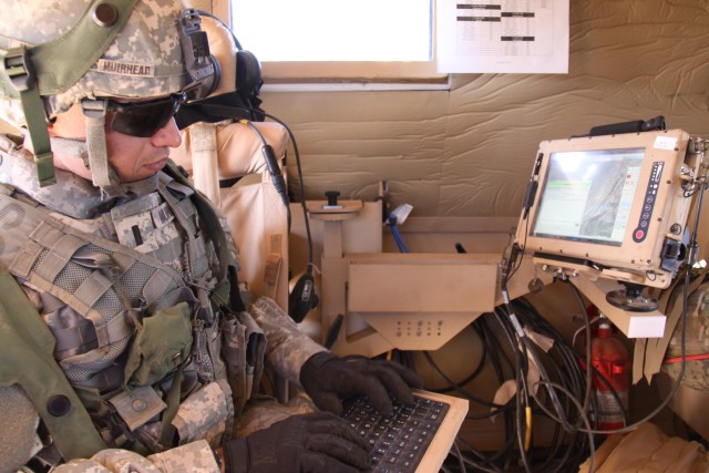 A 2nd Brigade, 1st Armored Division (2/1 AD) Soldier uses the chat function