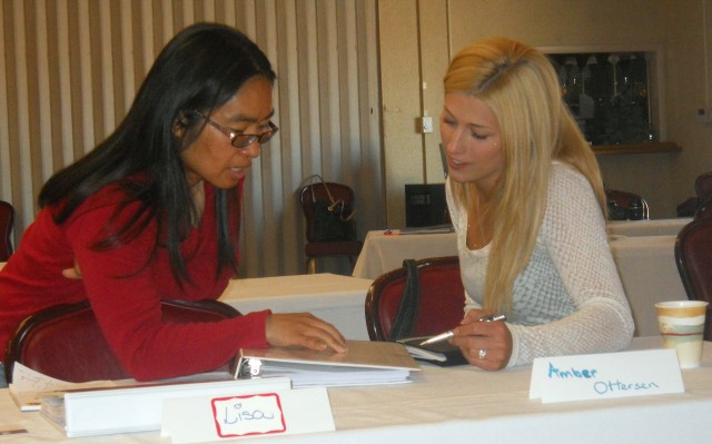 Spouses Kayoko Larrabee (left) and Amber Ottersen discuss information they learned during the Resilient Spouse Academy in May. Once a Soldier is assigned to Company A, 309th Military Intelligence Batt