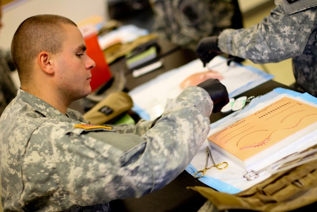 1-89 Cavalry medics practice stitching on their road to war