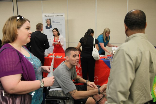 Wounded warrior meets with recruiter at career fair